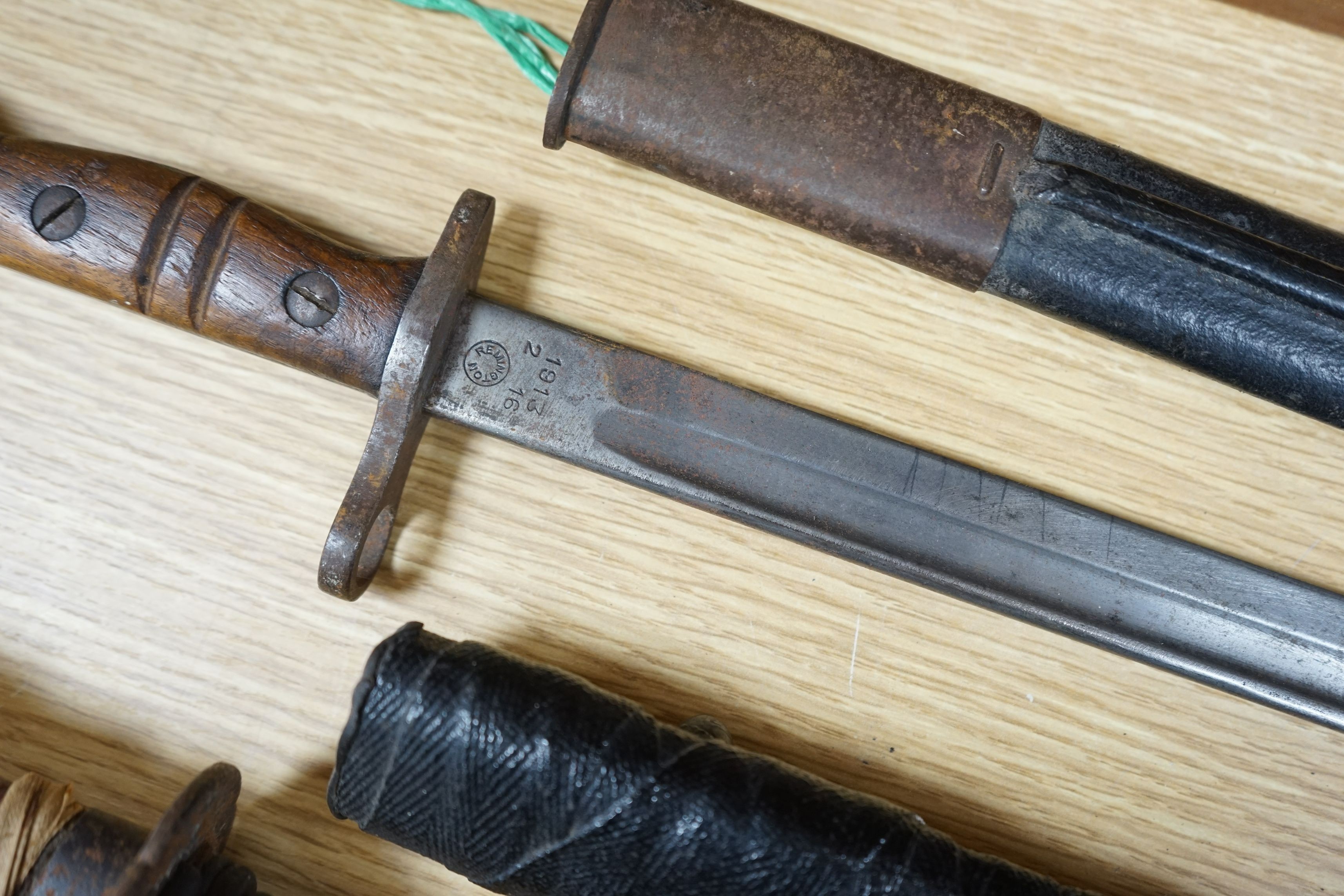 A Japanese wakizashi, a WWI bayonet and a Continental sword, sword 94cms long